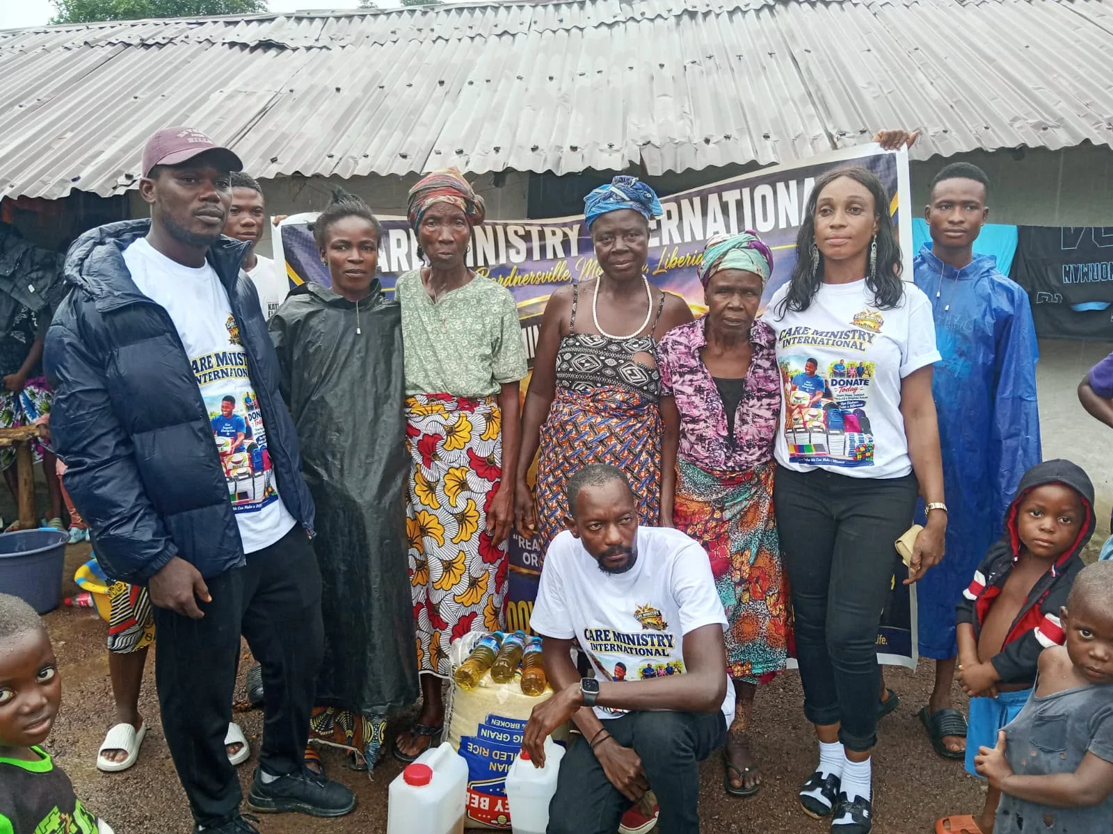 Care Ministry International team and community members gathered with food supplies